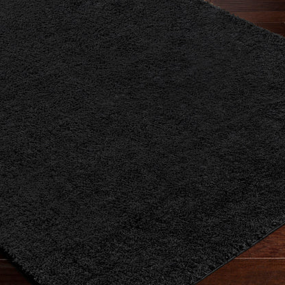 CLAIRE Round Shaggy Solid Color Plush Pile Black Area Rug Black Corner