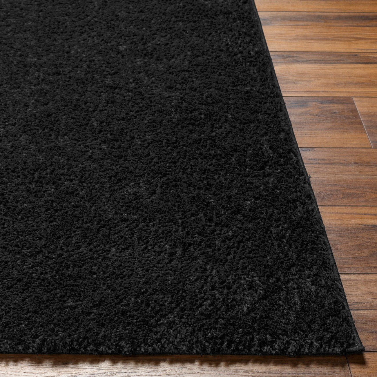 CLAIRE Round Shaggy Solid Color Plush Pile Black Area Rug Black Front