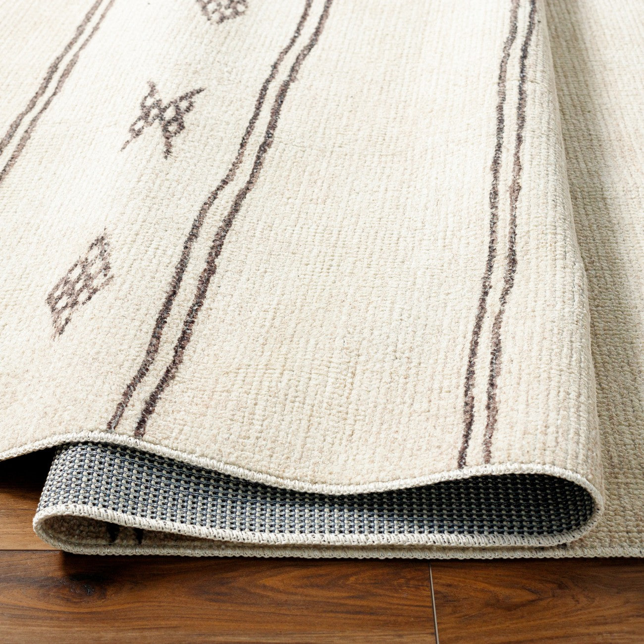 KIRAN Becki Owens x Livabliss Global Scandi Beige/Dark Brown Area Rug Fold