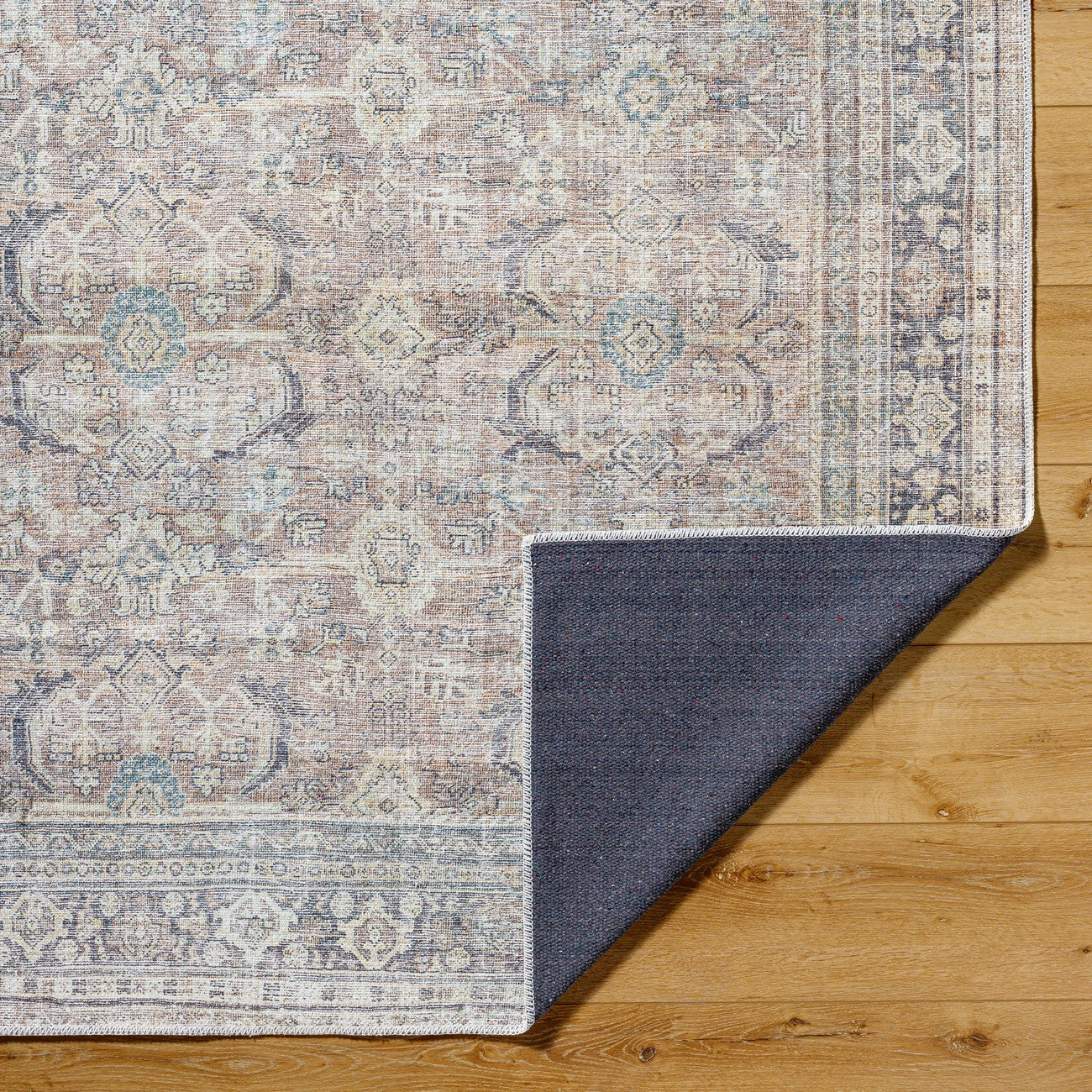 SHALINI Becki Owens x Livabliss Machine Washable Oriental Boho Light Silver Area Rug Fold