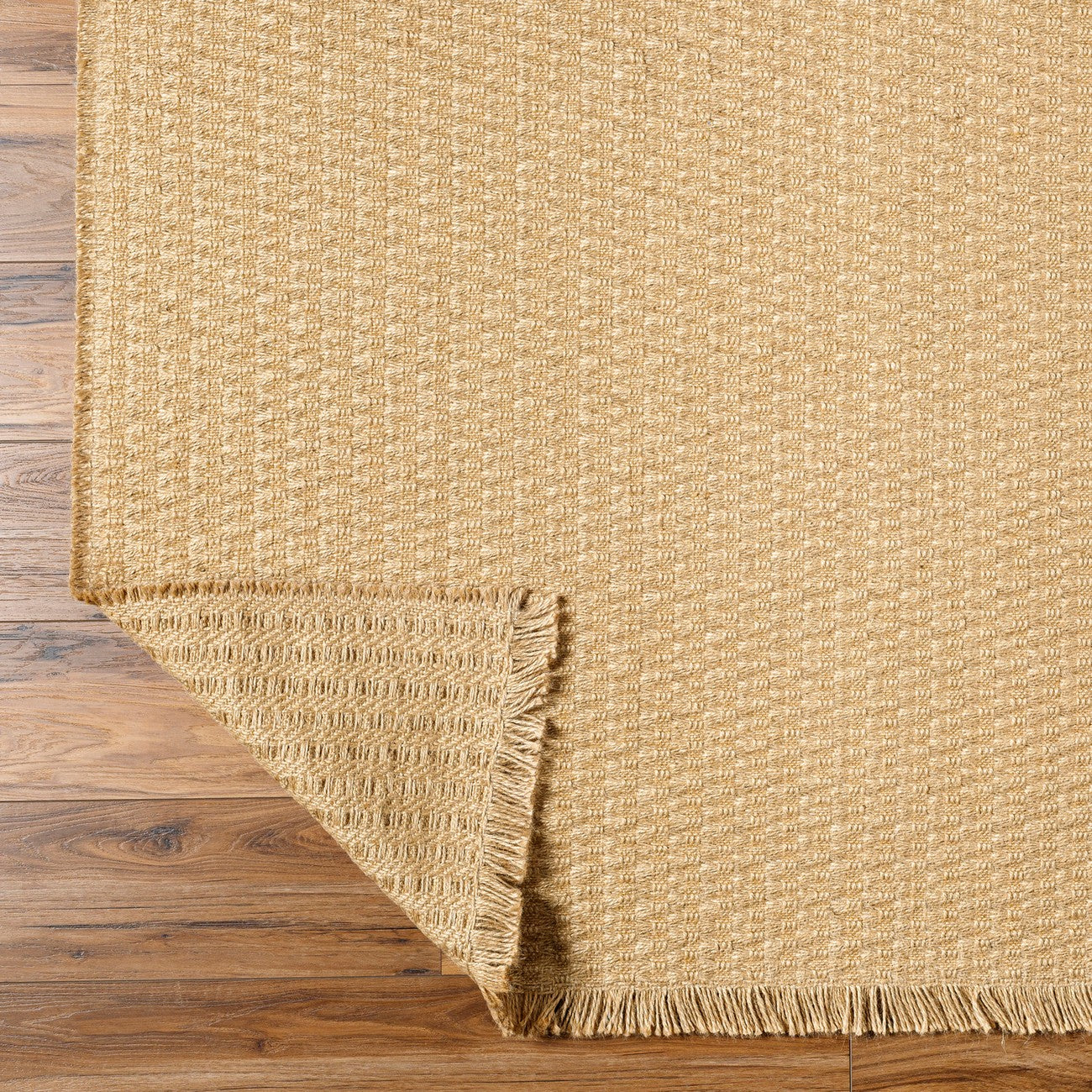 TOMI Becki Owens x Livabliss Natural Fiber Camel Jute Area Rug Fold